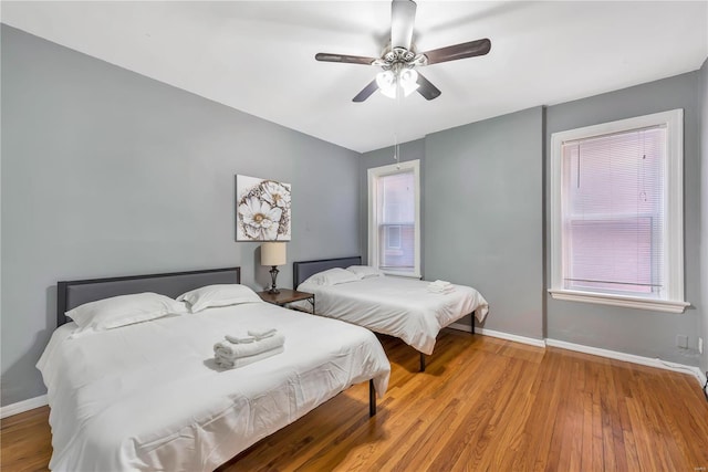 2107 Russell Blvd, Saint Louis, MO 63104 - bedroom with wood finished floors, baseboards, and ceiling fan