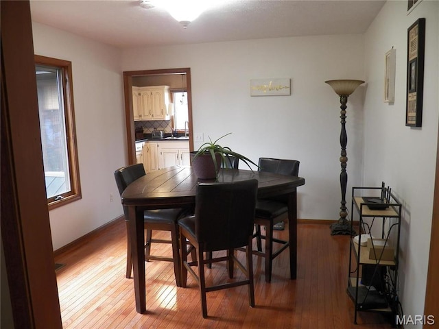 417 Carriage Pl, Lebanon, MO 65536 - dining space featuring light wood-style flooring and baseboards
