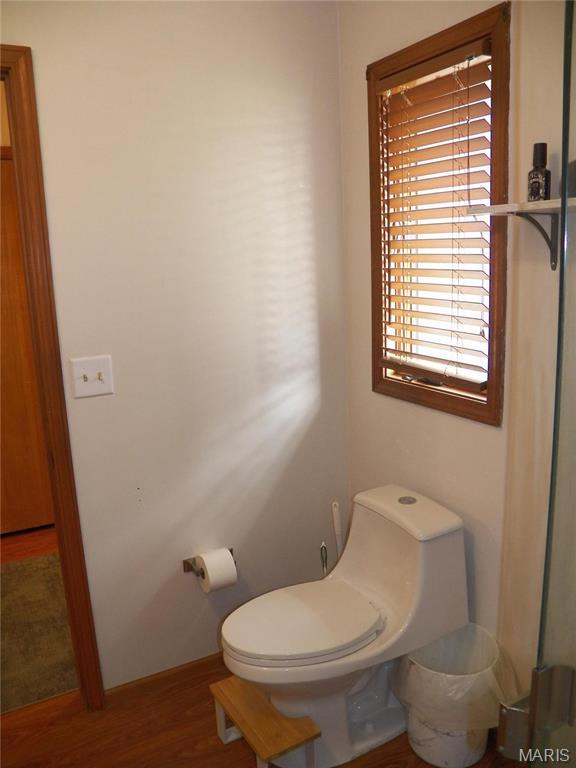 417 Carriage Pl, Lebanon, MO 65536 - bathroom featuring toilet and wood finished floors