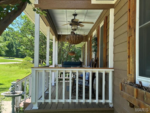 14348 Hidden Trails Cir, Dexter, MO 63841 - covered porch featuring ceiling fan and a lawn