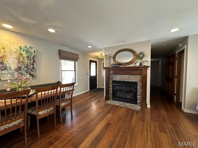 14348 Hidden Trails Cir, Dexter, MO 63841 - dining space featuring dark wood-style flooring, baseboards, a fireplace, and recessed lighting