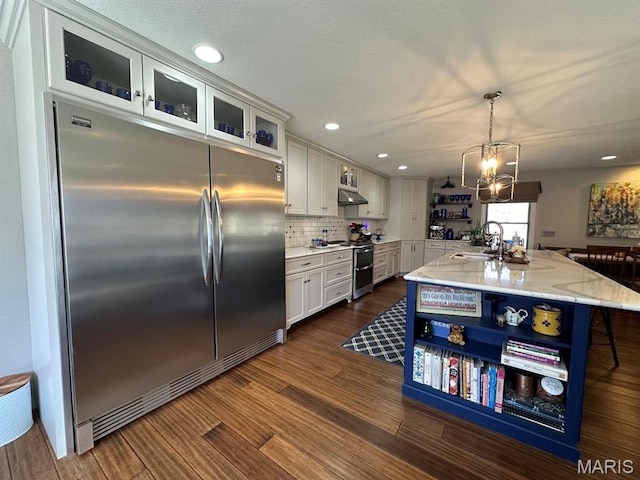14348 Hidden Trails Cir, Dexter, MO 63841 - kitchen featuring stainless steel appliances, open shelves, a sink, white cabinets, and light stone counters