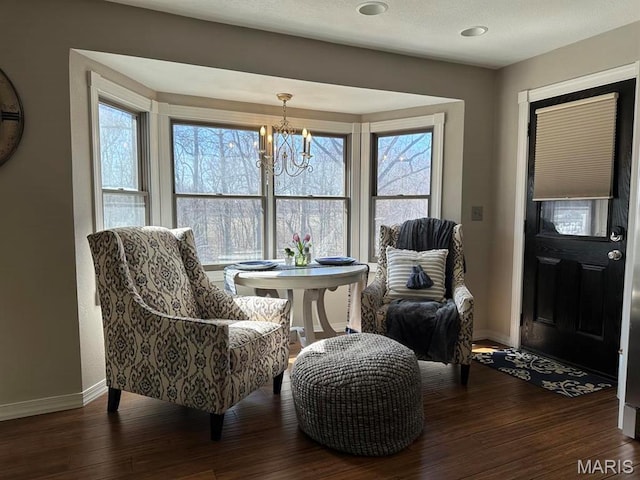 14348 Hidden Trails Cir, Dexter, MO 63841 - living area featuring a chandelier, baseboards, and wood-type flooring