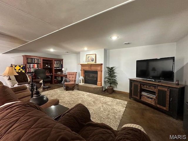 14348 Hidden Trails Cir, Dexter, MO 63841 - living area featuring a glass covered fireplace, recessed lighting, and concrete floors