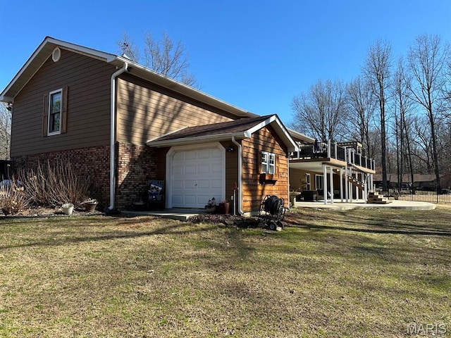 14348 Hidden Trails Cir, Dexter, MO 63841 - view of home's exterior with an attached garage, stairs, a lawn, and brick siding