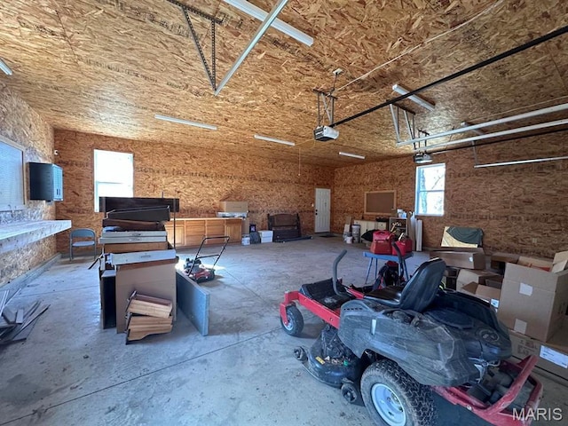14348 Hidden Trails Cir, Dexter, MO 63841 - garage featuring a garage door opener