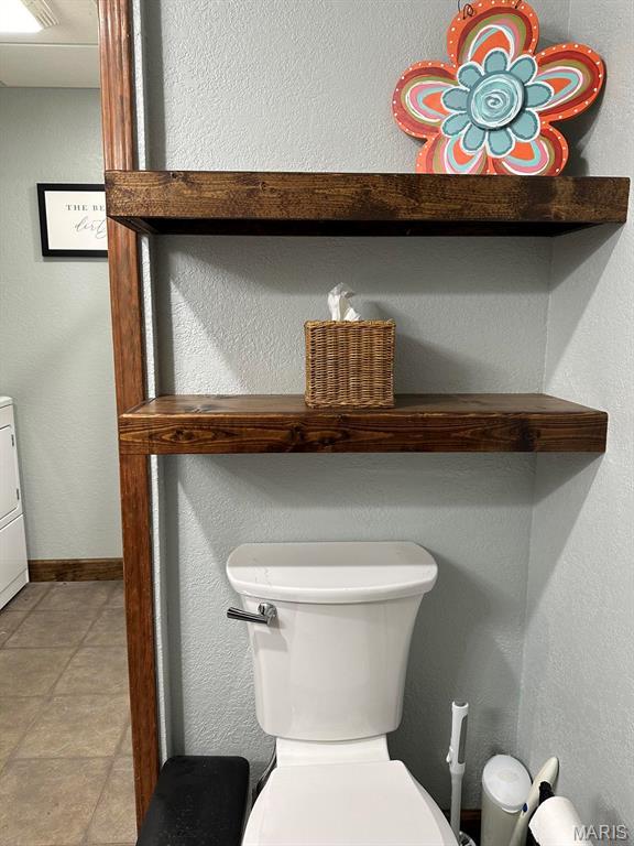 14348 Hidden Trails Cir, Dexter, MO 63841 - bathroom featuring toilet, baseboards, and tile patterned flooring