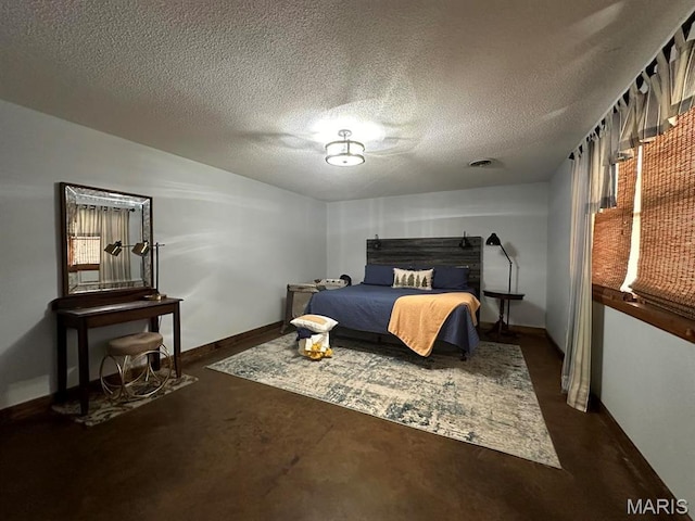 14348 Hidden Trails Cir, Dexter, MO 63841 - bedroom with baseboards, a textured ceiling, and concrete flooring
