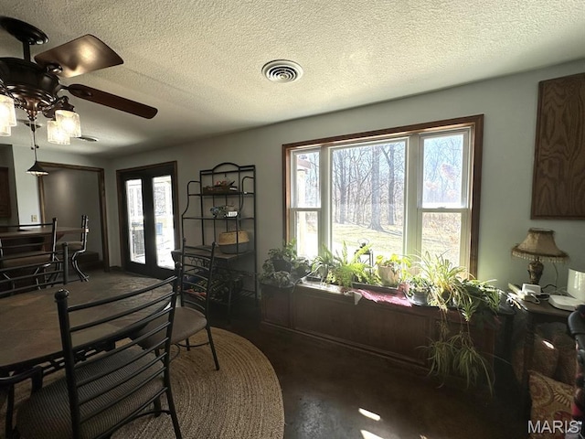 14348 Hidden Trails Cir, Dexter, MO 63841 - dining area featuring ceiling fan and a textured ceiling