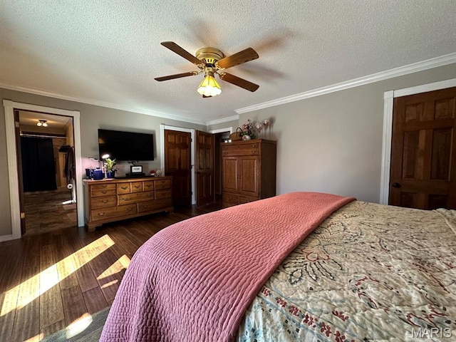 14348 Hidden Trails Cir, Dexter, MO 63841 - bedroom with crown molding, dark wood finished floors, a textured ceiling, a ceiling fan, and connected bathroom