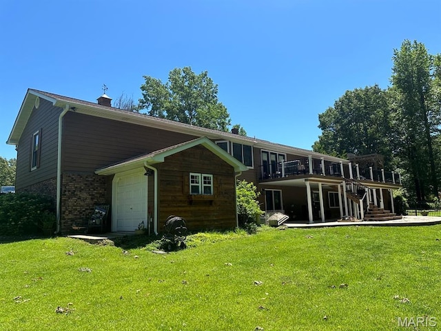 14348 Hidden Trails Cir, Dexter, MO 63841 - rear view of house with a yard, brick siding, an attached garage, and a chimney