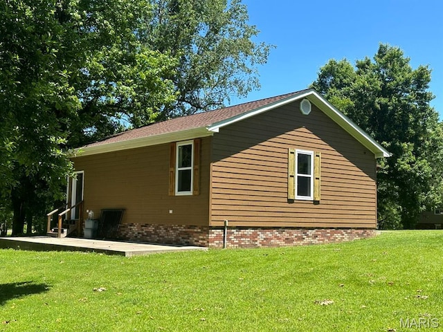 14348 Hidden Trails Cir, Dexter, MO 63841 - view of home's exterior featuring a lawn and a patio area