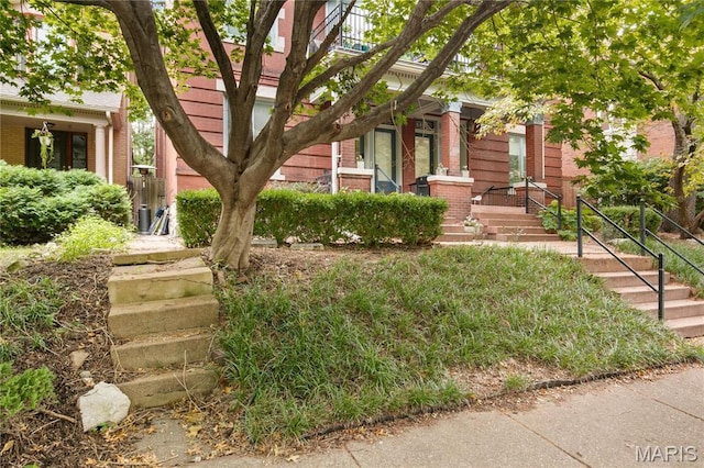 4486 Laclede Ave Unit 4486, Saint Louis, MO 63108 - view of property hidden behind natural elements with brick siding and stairs