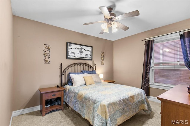 4486 Laclede Ave Unit 4486, Saint Louis, MO 63108 - bedroom with light carpet, baseboards, and a ceiling fan
