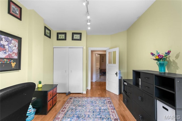 4486 Laclede Ave Unit 4486, Saint Louis, MO 63108 - home office featuring light wood-style floors and rail lighting