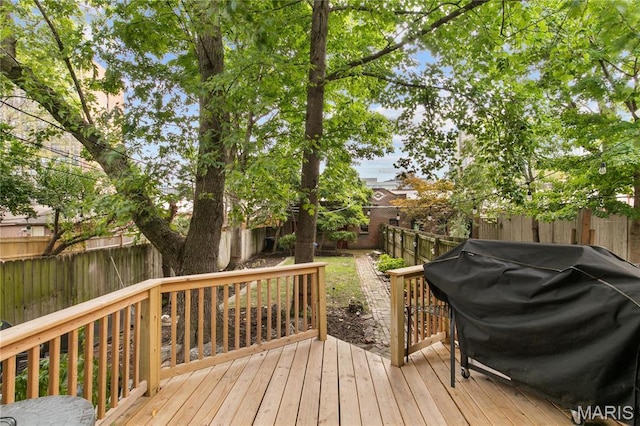 4486 Laclede Ave Unit 4486, Saint Louis, MO 63108 - wooden terrace with grilling area and a fenced backyard