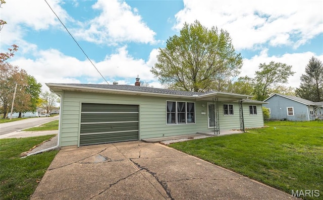 400 S Hickory St, Salem, MO 65560 - view of front of house featuring an attached garage, concrete driveway, a front yard, and a chimney