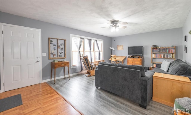 400 S Hickory St, Salem, MO 65560 - living room with ceiling fan, light wood-style floors, and baseboards