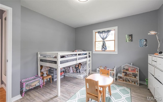 400 S Hickory St, Salem, MO 65560 - bedroom featuring light wood finished floors and baseboards