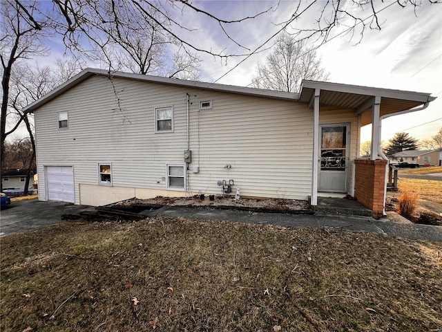 1505 Shelley Dr, Vandalia, IL 62471 - back of house with a garage and asphalt driveway