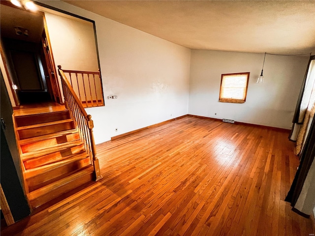 1505 Shelley Dr, Vandalia, IL 62471 - spare room featuring hardwood / wood-style flooring, stairs, and baseboards