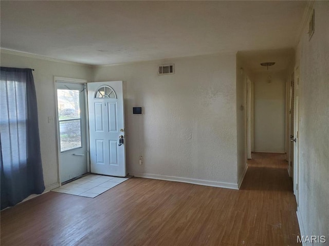 20 Leonard Dr, Cahokia, IL 62206 - foyer entrance with light wood-style floors, baseboards, and ornamental molding