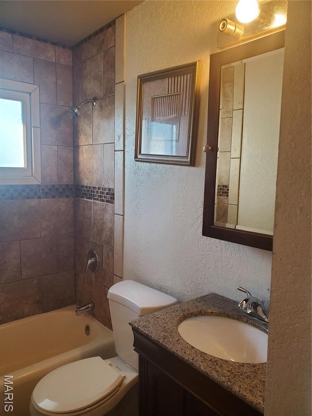 20 Leonard Dr, Cahokia, IL 62206 - bathroom featuring a textured wall, toilet, vanity, and shower / bathtub combination