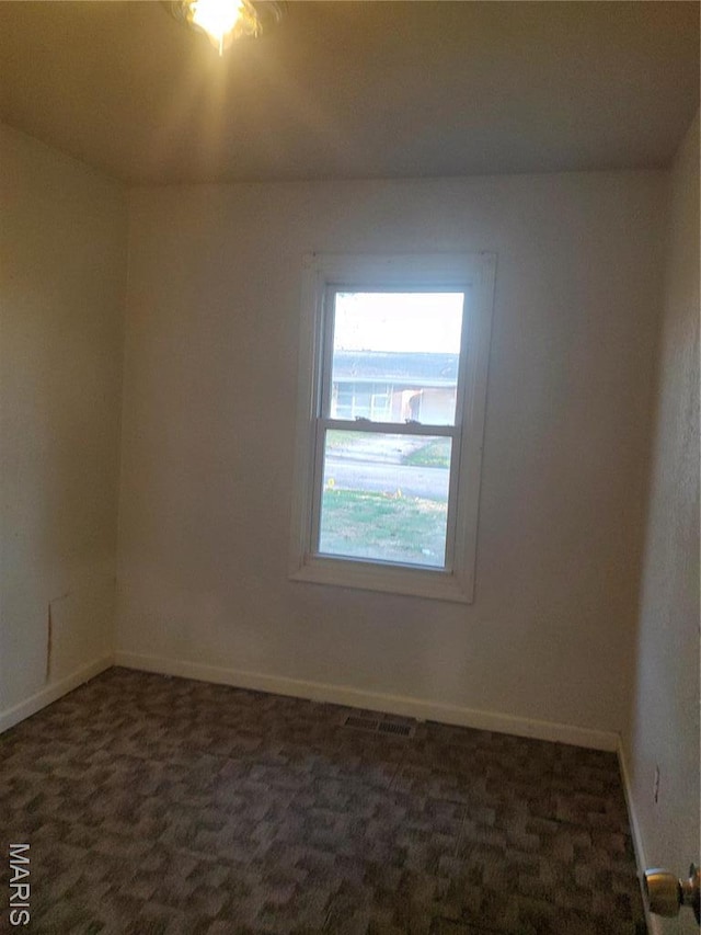 20 Leonard Dr, Cahokia, IL 62206 - spare room with dark colored carpet and baseboards