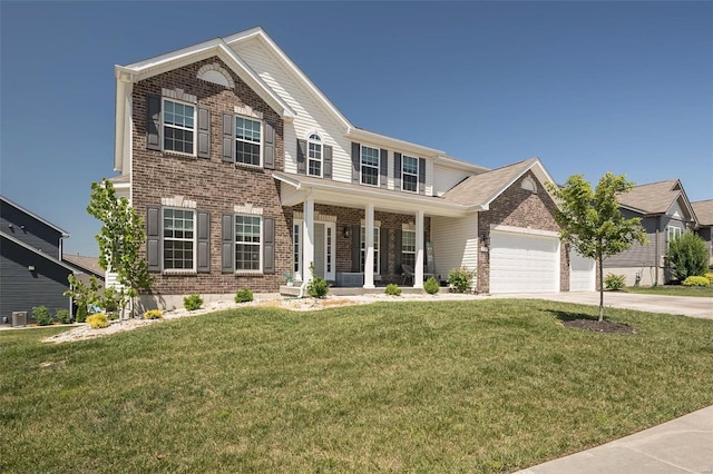 237 Mason Glen Dr, Lake St Louis, MO 63367 - view of front facade featuring brick siding, concrete driveway, covered porch, and a front lawn