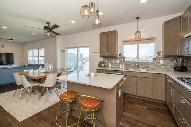 237 Mason Glen Dr, Lake St Louis, MO 63367 - kitchen with dark wood-style floors, decorative backsplash, a sink, and recessed lighting