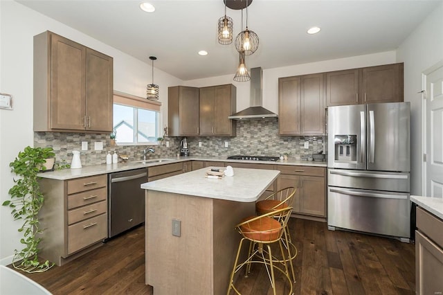 237 Mason Glen Dr, Lake St Louis, MO 63367 - kitchen featuring stainless steel appliances, wall chimney exhaust hood, dark wood-style floors, a kitchen island, and recessed lighting