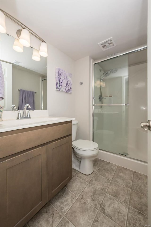 237 Mason Glen Dr, Lake St Louis, MO 63367 - bathroom featuring a shower stall, vanity, toilet, and tile patterned floors