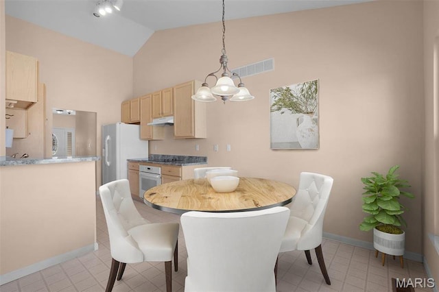 304 Spotted Fawn, Wentzville, MO 63385 - dining space with high vaulted ceiling, baseboards, and light tile patterned floors