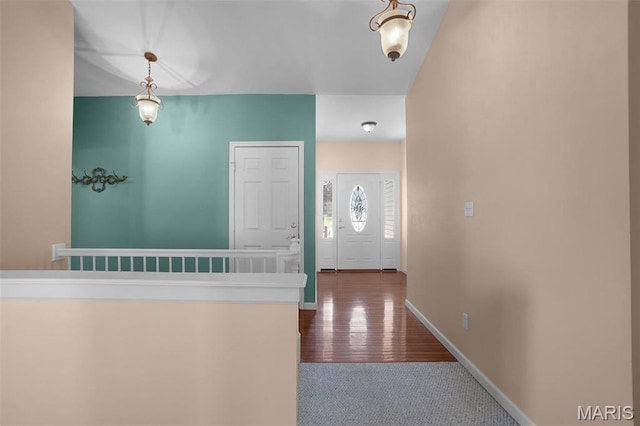 304 Spotted Fawn, Wentzville, MO 63385 - foyer entrance featuring dark carpet and baseboards