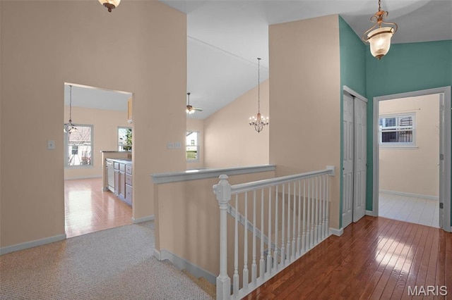 304 Spotted Fawn, Wentzville, MO 63385 - hallway with an upstairs landing, high vaulted ceiling, baseboards, and wood-type flooring