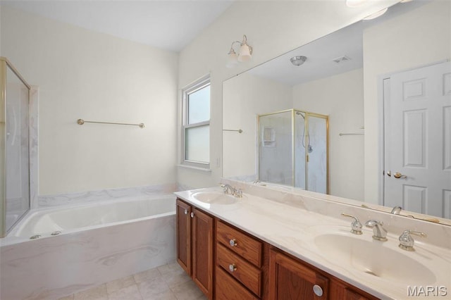 304 Spotted Fawn, Wentzville, MO 63385 - full bathroom with a bath, a shower stall, double vanity, and tile patterned flooring