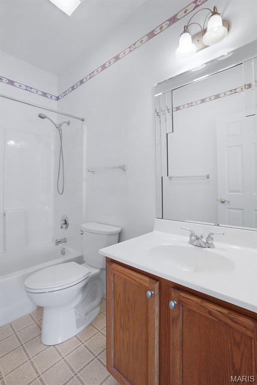 304 Spotted Fawn, Wentzville, MO 63385 - bathroom featuring vanity, toilet, shower / bathtub combination, and tile patterned floors