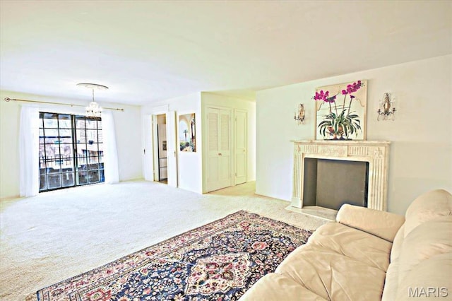 13515 Coliseum Dr Unit A, Chesterfield, MO 63017 - carpeted living area featuring a chandelier and a fireplace with flush hearth