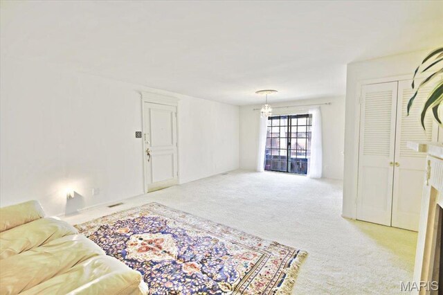 13515 Coliseum Dr Unit A, Chesterfield, MO 63017 - carpeted living area featuring a chandelier