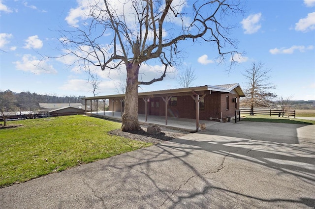 12044 State Route A, Saint Genevieve, MO 63670 - view of front facade with asphalt driveway, brick siding, and metal roof