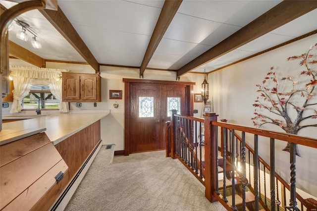 12044 State Route A, Saint Genevieve, MO 63670 - entryway with light colored carpet, beam ceiling, healthy amount of natural light, baseboard heating, and baseboards