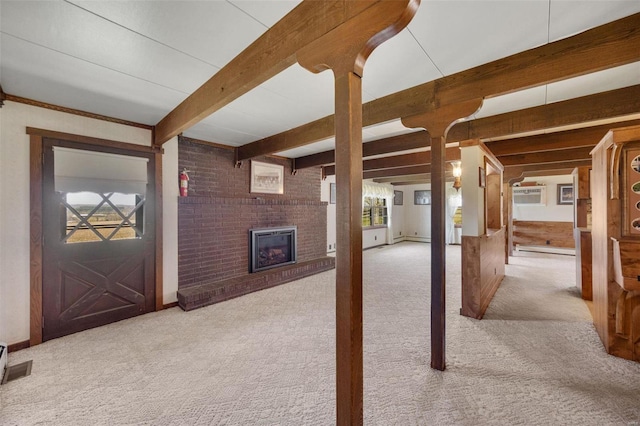 12044 State Route A, Saint Genevieve, MO 63670 - unfurnished living room featuring carpet floors, a brick fireplace, and beamed ceiling