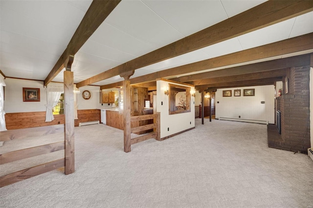 12044 State Route A, Saint Genevieve, MO 63670 - unfurnished living room with wooden walls, a brick fireplace, beam ceiling, a baseboard radiator, and carpet