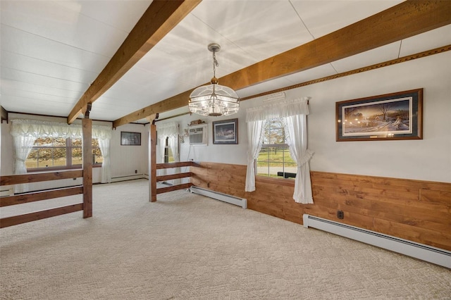 12044 State Route A, Saint Genevieve, MO 63670 - basement with a baseboard radiator, wooden walls, carpet, a wainscoted wall, and a chandelier