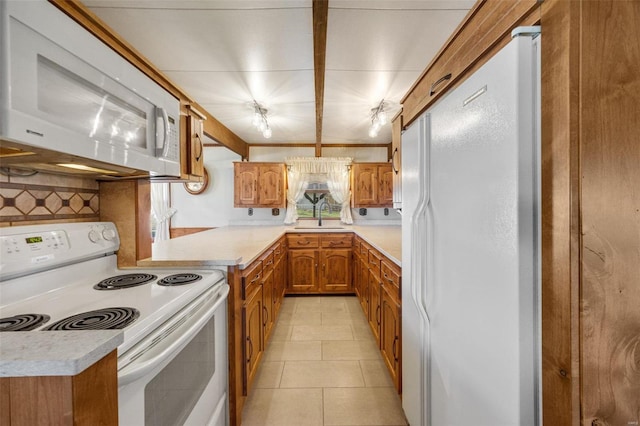 12044 State Route A, Saint Genevieve, MO 63670 - kitchen with white appliances, brown cabinets, light countertops, backsplash, and a sink