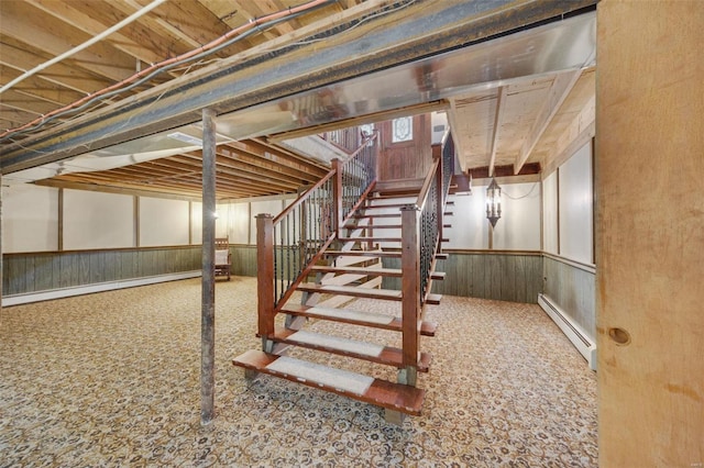 12044 State Route A, Saint Genevieve, MO 63670 - finished basement with a baseboard heating unit, stairway, carpet floors, wainscoting, and wood walls