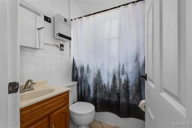 full bath with tile walls, toilet, and vanity