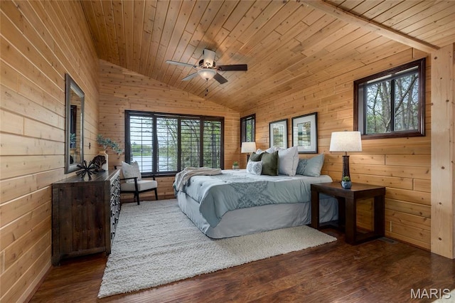 bedroom featuring vaulted ceiling, multiple windows, wood walls, wooden ceiling, and wood finished floors