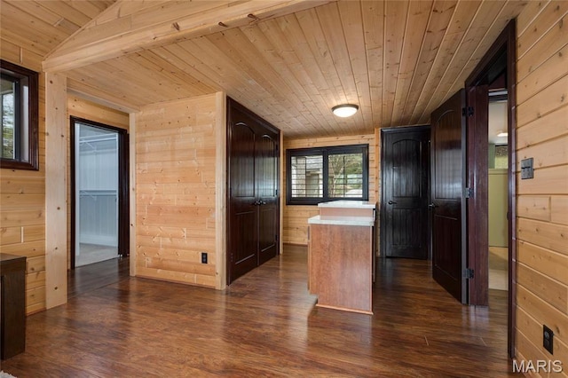 hall featuring wooden ceiling, wooden walls, and dark wood-style flooring