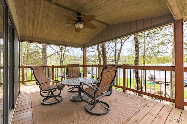 wooden deck with a ceiling fan